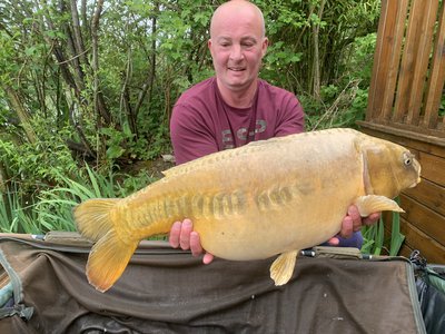 Fishery Manager Dave with a stunning Ghost Mirror of 21-08