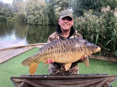 Adrian Bates with his new PB. A 26-13 Mirror from Kingfisher Lodge on Cherry Springs