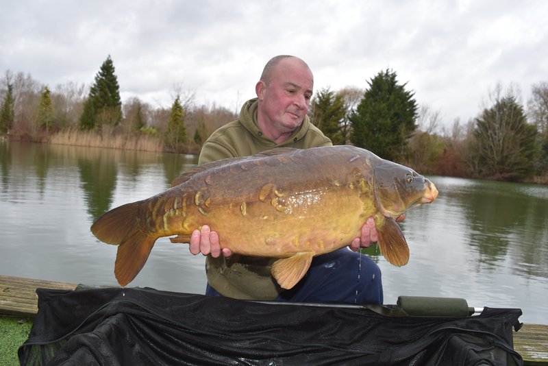 Fishery manager Dave Bowen with an impressive  28lb Mirror  stocked into Cherry Pool in January 2023