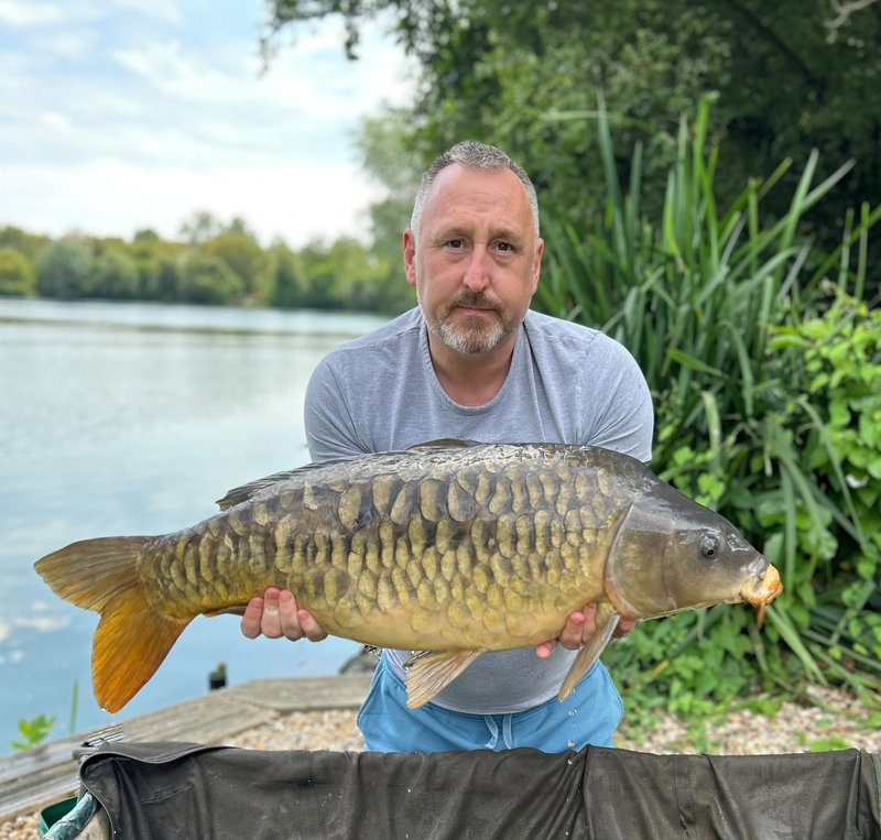 Simon Pearson with a Fully Scaled Mirror from the Cottage swim