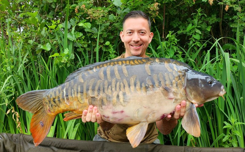 Mark NG with a beautiful 28lb Fully Scaled Mirror