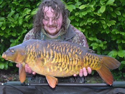 David Carter was very pleased with this heavily scaled Cherry Lake Mirror of 23lb from the Cottage swim..jpg