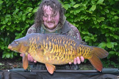 David Carter was very pleased with this heavily scaled Cherry Lake Mirror of 23lb from the Cottage swim..jpg
