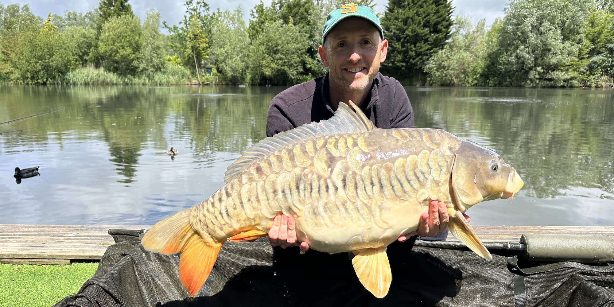 Ian Turnbull with a float caught Mirror of 30-02 from Cherry Pool