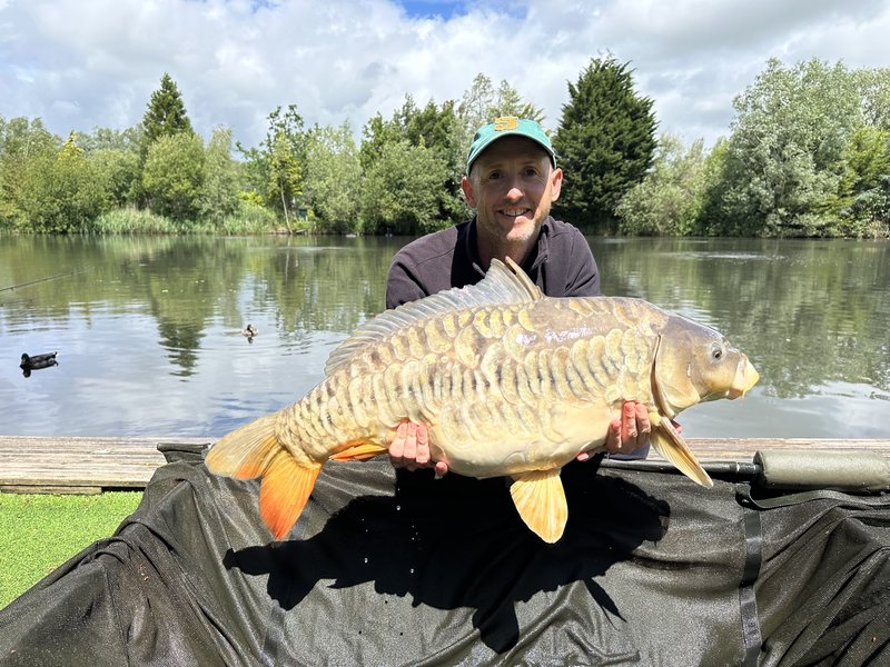 Ian Turnbull with a float caught Mirror of 30-02 from Cherry Pool