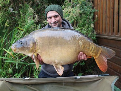 Steve Shepherd with the new Cherry Lake record Ghost Carp. a stunner of 37-12